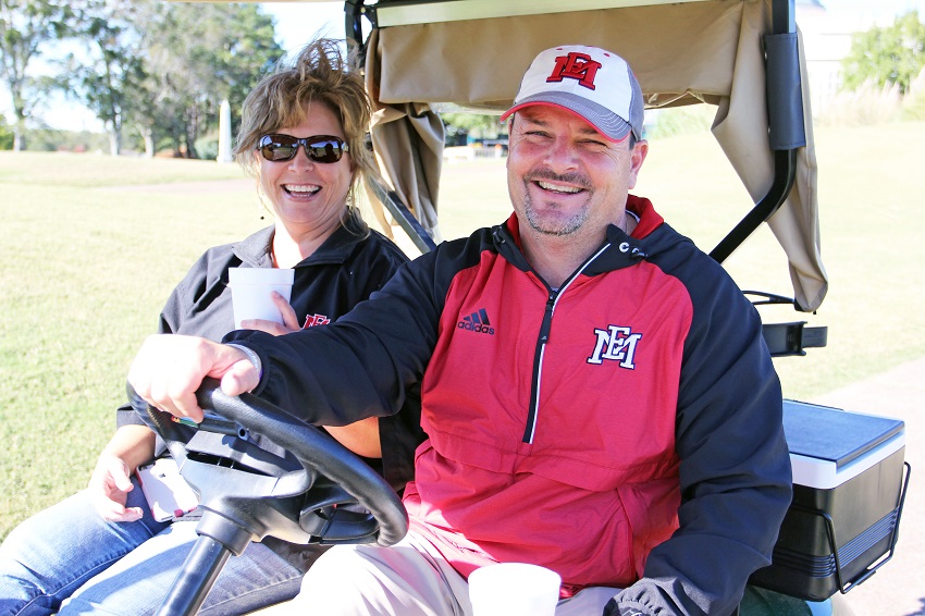 Longtime EMCC employees Gina Cotton and Marcus Wood take a moment to relax during the EMCC-Old Waverly Golf Classic. Cotton and Wood are now leading the college’s alumni relations efforts.