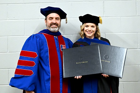 East Mississippi Community College alumna Dr. Shelley Rae Edwards, MD, PhD, at right, is pictured here with her PhD mentor, Kevin Freeman, PhD, a behavioral pharmacologist at the University of Mississippi Medical Center.
