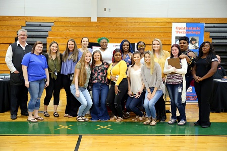 Students in East Mississippi Community College’s Cosmetology at a West Point High School college fair. The students work with the general public on Wednesdays under the guidance of Cosmetology instructor David Long, at left. The students are, front row, from left: Savannah Shinn of West Point; Jordan Sellers of Louisville; Angela Shelton of Crawford; Katie Hargett of Starkville; Macey Gimmel of Ackerman; and Oklyn Newell of Starkville. In the second row, from left, are: EMCC Cosmetology instructor David Long; Emily Teague of Columbus; Taylor Rivera of Houston, Texas; Kaitlyn Oswalt of Columbus; Emily Landry of Tylertown; Brittany Brown of West Point; Valencia Buckingham of Aberdeen; Quahsima Brooks of Columbus: Lexie Doss of Houston; Tangela Williams of Chicago, Ill., Shatesha Lee of West Point.