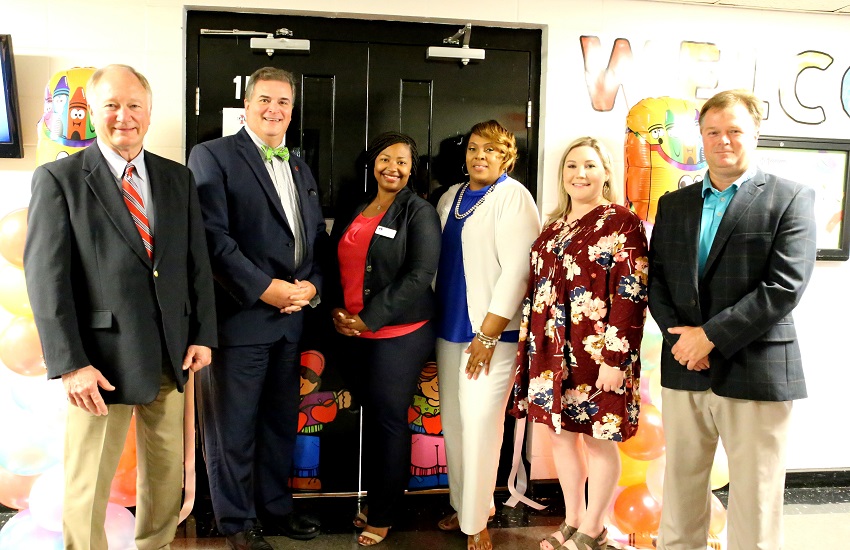 An open house and ribbon cutting was held Tuesday, July 17, for the Early Childhood Academy on East Mississippi Community College’s Golden Triangle campus. Pictured, from left, are EMCC Interim President Dr. Rick Young, EMCC Vice President for the Golden Triangle campus Dr. Paul Miller, Assistant Executive Director of the Early Childhood Academy at Mississippi Community College Dr. Micca Knox, ECA Coach and Professional Development Specialist Carolyn Harris, ECA Resource and Referral Center Associate Michelle Cleveland, and EMCC Associate Dean of Instruction Dr. Michael Busby.