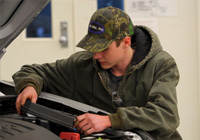 East Mississippi Community College student Cameron Bryce Hitt is one of five Automotive Technology students chosen to participate in a new pilot program that will allow students to earn certification through the University of Toyota. Here, Hitt inspects a 2015 Toyota Camry during a class exercise.