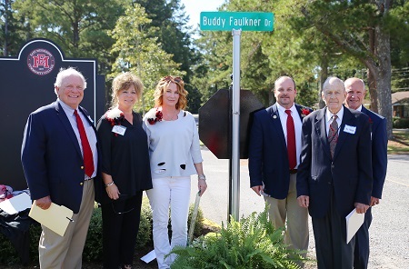 During East Mississippi Community College’s Homecoming activities, a road on the college’s Scooba campus was renamed and dedicated in memory of the late Buddy Faulkner, a long-time supporter of the college. Pictured at the dedication are, from left, former EMCC Vice President of Institutional Advancement Nick Clark, EMCC Director of Alumni Affairs and Foundation Operations Gina Cotton, Tina Faulkner, the wife of Buddy Faulkner, EMCC Executive Director of College Advancement Marcus Wood, EMCC Development Foundation Board member Ike Hopper, and EMCC Interim President Dr. Randall Bradberry. 