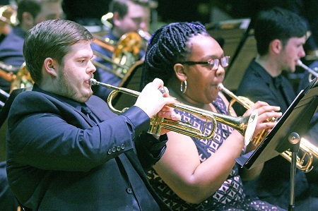 Members of East Mississippi Community College’s Mighty Lion Band will perform during the college’s Fine Arts Holiday Celebration Nov. 27. Here, current band member William Hodge and former band member Deja Allen perform during an event last year.