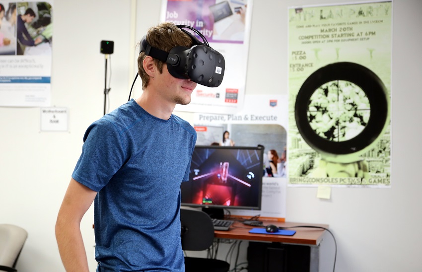 East Mississippi Community College Cyber Security student Karl Mast of Brooksville plays the virtual reality game Beat Saber, which will be among the many games available for play during the college’s LAN party on Sept. 21.