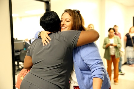 East Mississippi Community College Associate Degree Nursing instructor Karen Taylor, at right, hugs Jessica Young, one of 12 students enrolled in the college’s new LPN to RN Transitions Track program, which will prepare them to become registered nurses. All 12 students are former graduates of EMCC’s LPN program.