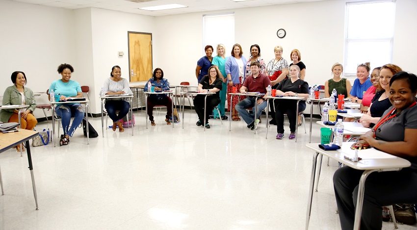 All 12 students enrolled in East Mississippi Community College’s new LPN to RN Transitions Track program graduated from the college’s Licensed Practical Nurse program. Here is a list of the students, their hometowns and the year they graduated from the LPN program. They are, sitting, from left: Kelly Butler of Columbus (2016); Adrianna Sykes of Columbus (2016); Monique Bradshaw of West Point (2002); Kimberly Rogers of Pheba (2014); April Junkin of Steens (2008); Tyler West of Starkville (2009); Heather Reed of Steens (2006); Ashley Pollard of West Point (2014); Jessica Smith of Hamilton (2014); Gretchen Neal of Columbus (2014); Patricia Reeves of Columbus (2015); and Jessica Young of Starkville (2012). Instructors are, standing, from left: Eljenette West, MSN, RN; Terasa Harpole, MSN RN; Karen Taylor, MSN, RN; Director of Nursing and Allied Health Dr. Tonsha Emerson, DNP, RN, CNE; Suzy Tillett, MSN, RN; and Jenny Caldwell, MSN, RN.