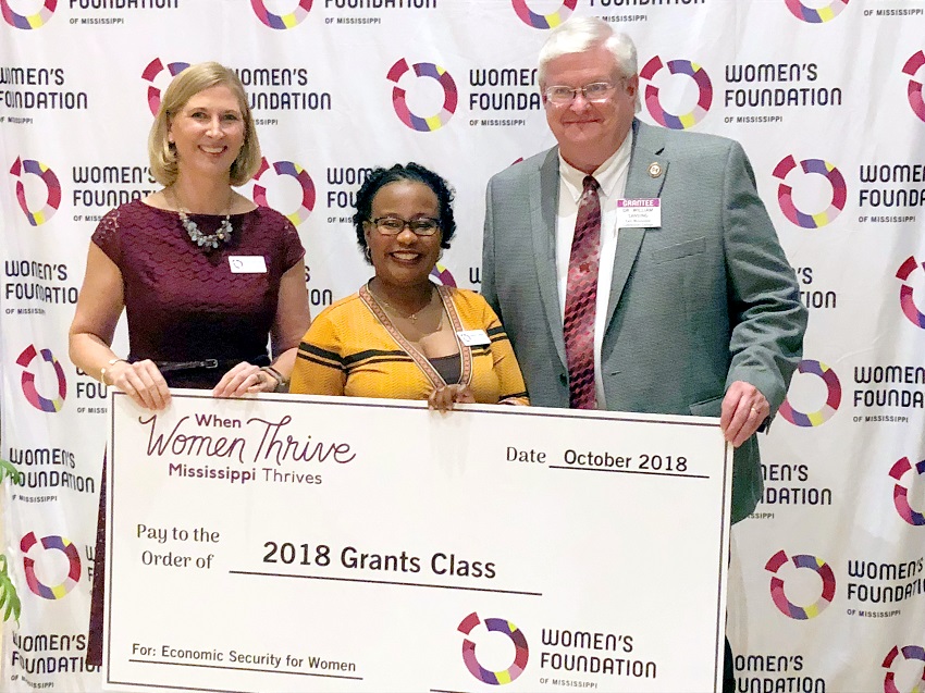 From left, Women’s Foundation of Mississippi Executive Director Tracy DeVries and Director of Grant Programming Latisha Latiker present East Mississippi Community College Associate Dean of Instruction William Sansing with a ceremonial check during the Women of Vision 2018 in Jackson. EMCC was awarded $20,000 by the Women’s Foundation of Mississippi to launch the Plan2Postpone, or P2P, campaign.