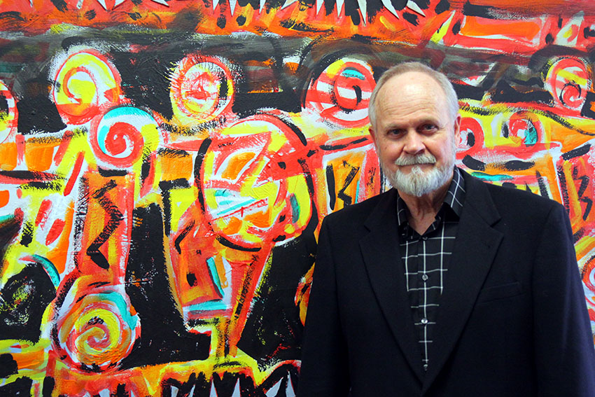The works of East Mississippi Community College art instructor Terry Cherry are on exhibit at Mississippi Gulf Coast Community College and will soon be featured at the Mississippi University for Women. Cherry is pictured here with one of his paintings on display on EMCC’s Scooba campus.