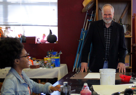East Mississippi Community College art instructor Terry Cherry gives pointers to Brejenn Allen.