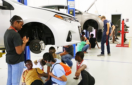 Students enrolled in Camp AMP on East Mississippi Community College’s Golden Triangle campus learn to remove and install brake pads. Camp AMP exposes students to manufacturing at an early age.