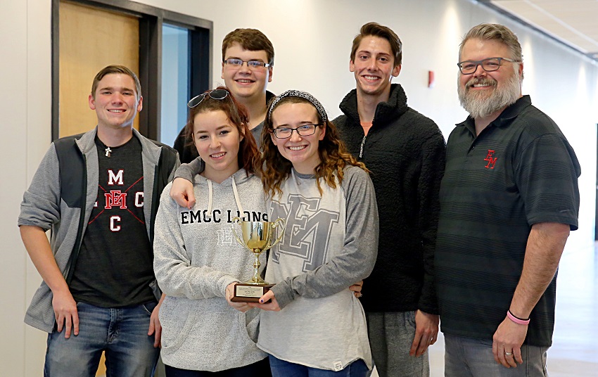 East Mississippi Community College’s quiz bowl team took first place in the 2019 Community College Sectional Championship Quiz Bowl Tournaments Jan. 25 and qualified to compete nationally. Pictured in the front row with the team’s trophy are, from left, Hayley McCann and Belle Ferrebee. In the back row are, from left, Justin Labonte, Cameron Wilcox, Jaden Bennett, and EMCC Quiz Bowl Coach Scott Baine.