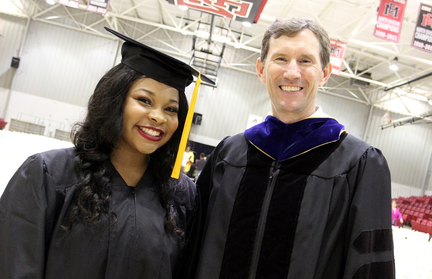 Kelsey Hearn, at left, is congratulated by East Mississippi Community College President Dr. Scott Alsobrooks during the college’s May 4 commencement ceremony on the Scooba campus. Hearn, who was among the graduates, will graduate from Kemper County High School May 24.