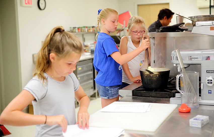 Children enrolled in the Kids Culinary Camp at East Mississippi Community College’s Lion Hills Center prepare a dish.