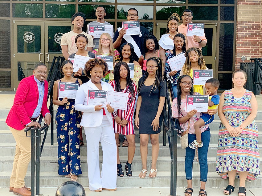 Dustin Atkinson, bottom far left, and Shannon Pendergrass, bottom far right, are instructors for East Mississippi Community College’s Lion Academy, which helps prepare high school students to take college courses. Atkinson and Pendergrass are pictured here with Lion Academy graduates during a June 27 ceremony on EMCC’s Scooba campus.