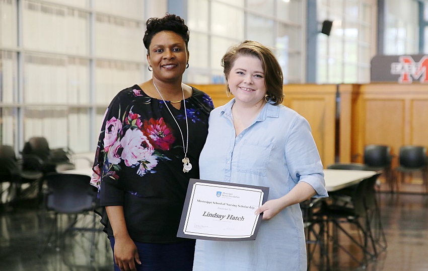 East Mississippi Community College Division of Nursing and Allied Health Director Dr. Tonsha Emerson, at left, presents Associate Degree Nursing student Lindsay Hatch with a certificate in recognition of her selection as a recipient of a 2019 Mississippi Nurses Foundation School of Nursing Scholarship.