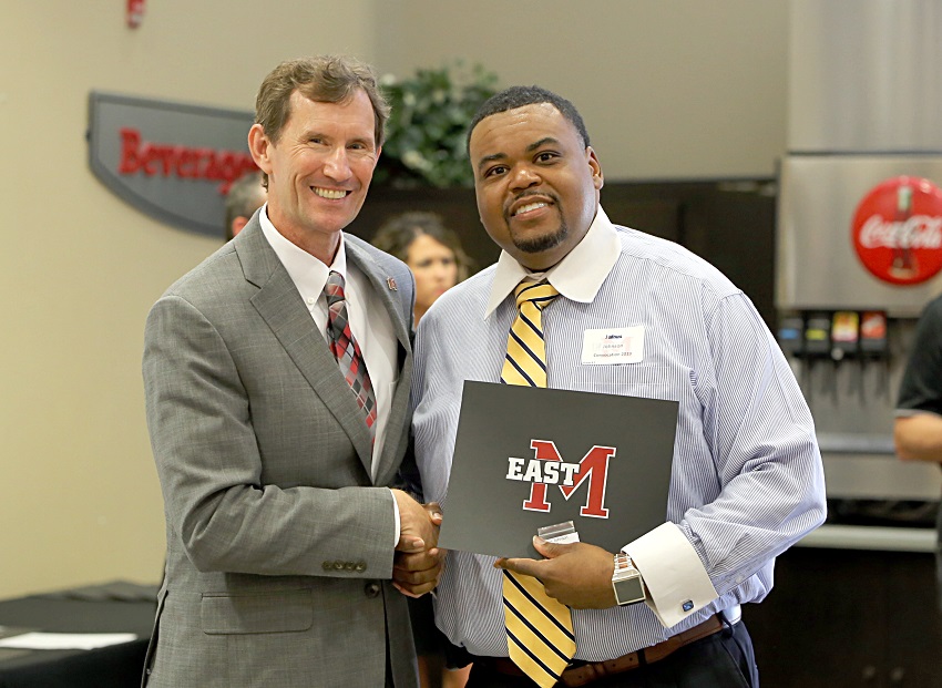 EMCC Math and Science Scooba Campus Division Chair Jairus Johnson is presented a service award certificate for his 15 years of employment with the college by EMCC President Dr. Scott Alsobrooks. Johnson was among 32 EMCC employees presented service awards Aug. 12 during the college’s annual convocation. 