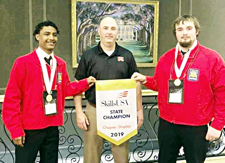 East Mississippi Community College students Isiah Woods of Louisville, at left, and Dylan Copeland of Nanih Waiya took first place in the Chapter Display Team Welding category during the Mississippi SkillsUSA Championships in Jackson. Both students, who are pictured with welding instructor Shane McDaniel, are enrolled at the college’s Scooba campus.