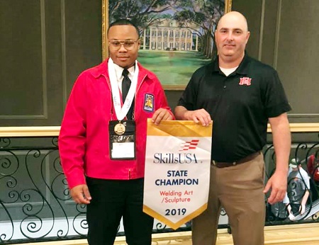 East Mississippi Community College student Bryson Jenkins of DeKalb, at left, took first place in Welding Sculpture in the Mississippi SkillsUSA Championships in Jackson. He is enrolled in the Welding Technology Program at the college’s Scooba campus, which is taught by welding instructor Shane McDaniel, at right.