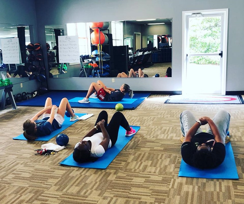 East Mississippi Community College Director of Wellness and Intramurals Cathy Castleberry leads an ab class at the Wellness Center on the Scooba campus, which is accepting summer memberships from the public.