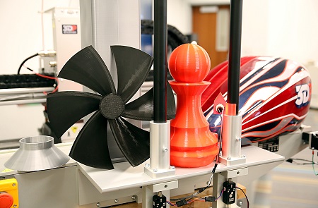 These are some of the test items printed by the new 300 Series Workbench Pro 3D printer in East Mississippi Community College’s Engineering Technology, Drafting & Design program, which will be used to teach students additive manufacturing skills. The mock motorcycle tank at the far right was painted by officials with 3D Platform, which manufactures the printers.