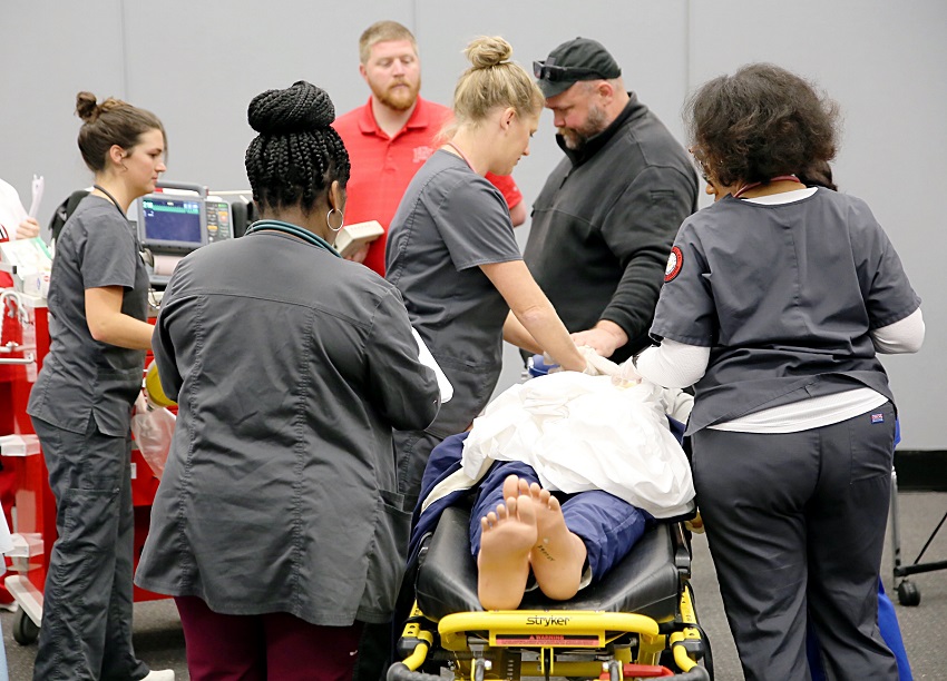 Students enrolled in East Mississippi Community College’s Division of Nursing and Allied Health participate in a March medical emergency simulation prior to the outbreak of the coronavirus. A drive-by graduation for students in the Paramedic, Practical Nursing and Surgical Technology programs will take place July 25. 