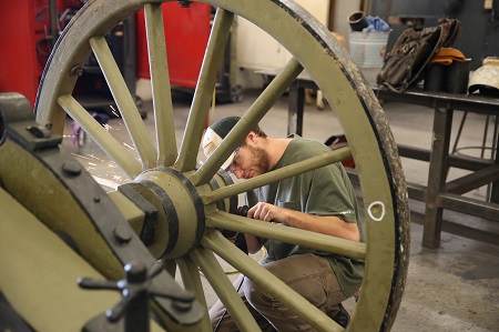 East Mississippi Community College Welding Technology student Douglas Glenn of Columbus grinds rust from a cannon carriage last fall. The carriage, believed to have been built in 1901, is being used to display an antique cannon at Mississippi State University’s Ulysses S. Grant Presidential Library.