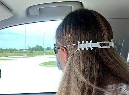 East Mississippi Community College’s Communiversity is making comfort straps used in tandem with surgical masks and donating them to local industries for use by their employees. Here, Communiversity Executive Director Dr. Courtney Taylor demonstrates how the straps are used. 