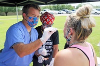 Dr. Cameron Huxford, a pulmonary critical care physician, administers a COVID-19 test to a student at East Mississippi Community College’s Scooba campus on Thursday. Huxford and OCH Regional Medical Center in Starkville are providing COVID-19 testing to EMCC students as part of a community outreach service. 