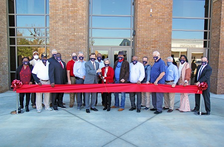 East Mississippi Community College administrators and members of the Board of Trustees were joined by area legislators, county supervisors and officials from K-12 schools for a Dec. 10 ribbon cutting for a new student residence hall on the college’s Scooba campus.