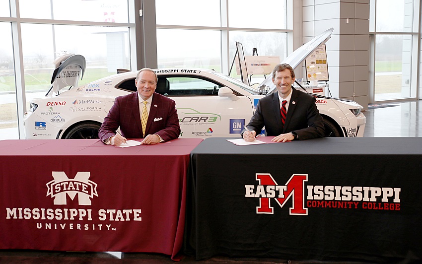 Mississippi State University President Dr. Mark E. Keenum, at left, and East Mississippi Community College President Dr. Scott Alsobrooks sign a memorandum of understanding that will allow graduates of EMCC’s career technical programs to transfer their credits to MSU’s new Bachelor of Applied Science program.