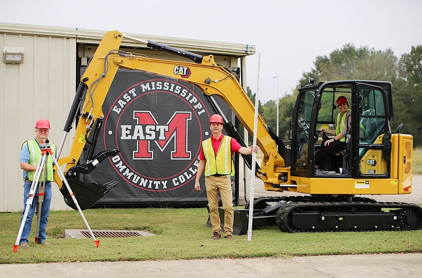 East Mississippi Community College’s new Heavy Civil Construction program will teach students how to, among other things, operate heavy equipment, such as this excavator and backhoe. Mike Duke, at left is the program manager and lead instructor for the program. Pictured with Duke are Dean for the Manufacturing, Technology and Engineering Division Joe Cook, at right, and Executive Director of The Communiversity and Workforce Development Dr. Courtney Taylor. 