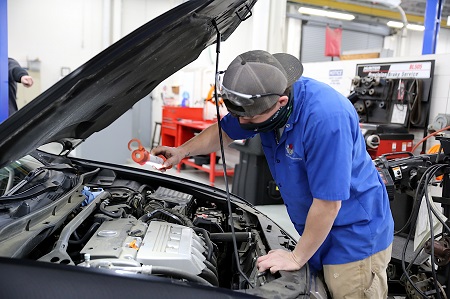 East Mississippi Community College Automotive Technology program student Johnathan O’Brien of West Point works on a car during a class on the college’s Golden Triangle campus.