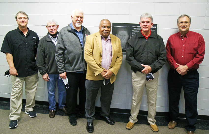 Sons Chris Cheatham (far left) and Brad Cheatham (far right) pose with EMCC Board of Trustees members on EMCC’s Scooba campus Monday night after a plaque dedication honoring their father, former EMCC President Clois Cheatham. Board members pictured, from left, include Bubba Davis, Jimmie Moore, Ed Mosley and Bobby McDade.