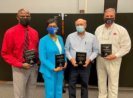 From left, West Point Consolidated School District Superintendent Burnell McDonald, East Mississippi Community College Board of Trustees member Hazel Johnson, Bo Diermann and EMCC Vice President of Operations Dr. Paul Miller were recognized during the annual Golden Triangle Early College High School Awards Day for their contributions to the school.