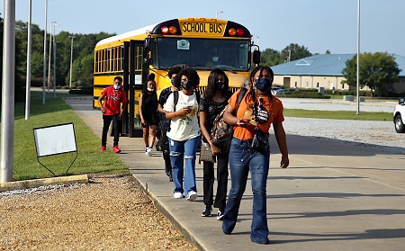 Students from Noxubee County who are enrolled at the Golden Triangle Early College High School on East Mississippi Community College’s Mayhew campus arrive for the first day of class on Aug. 9.
