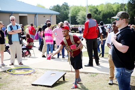 East Mississippi Community College’s Pine Grove Arts Festival returns April 13-21. Here, a student takes part in one of the games at a previous festival on the Golden Triangle campus.