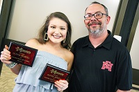 Olivia Newell, at left, was named the recipient of both the Outstanding Human Anatomy & Physiology II Student and the Outstanding American Literature Student during Awards Day on East Mississippi Community College’s Scooba campus. Newell is pictured here with humanities instructor Derrick Conner, who presented her with the American Literature award. 