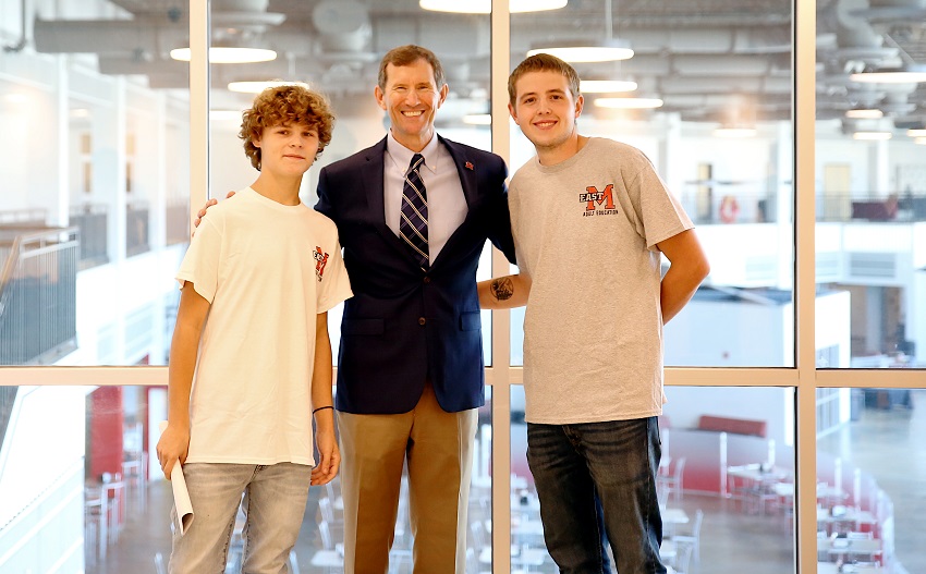 EMCC Adult Education Launch Pad students Trey Logan, at left, and Brandon Miller, at right, are pictured here with EMCC President Dr. Scott Alsobrooks. Logan and Miller were guest speakers Sept. 22, 2022 at a meet and greet hosted by the Launch Pad.