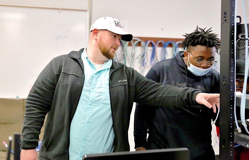 East Mississippi Community College Computer Networking Technology instructor Jordan Miller, at left, works with Columbus resident Jamario Macon, who is taking the course on the college’s Golden Triangle campus. Miller will teach the program at the college’s Scooba campus during the fall term that begins in August.