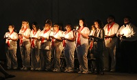 East Mississippi Community College Practical Nursing graduates take part in a ceremonial lighting of the lamps during a July 29 commencement ceremony at the college’s Golden Triangle campus. 