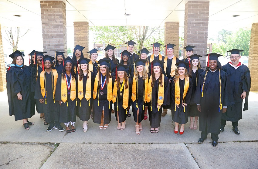Graduating members of the Phi Theta Kappa Honor Society on East Mississippi Community College’s Scooba campus pose with PTK advisors Janet Briggs, far left, and Derrick Conner, far right, prior to the commencement ceremony on May 13. Two graduation ceremonies on the Golden Triangle campus took place May 12. 