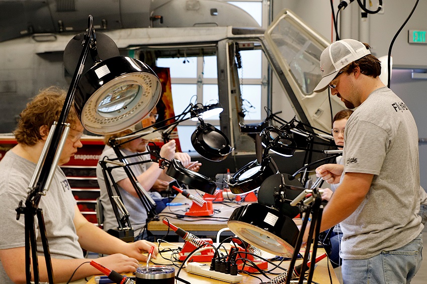 Students enrolled in the Aviation Manufacturing Technology program at The Communiversity at East Mississippi Community College work in the Avionics Cabling lab.