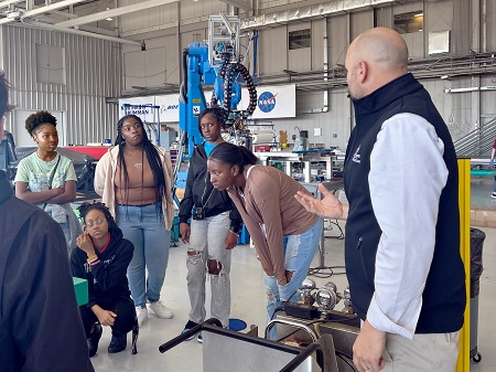 In October, students enrolled in the Golden Triangle Early College High School on EMCC’s Mayhew campus toured the Advanced Composites Institute (ACI) at Mississippi State University. EMCC and ACI are partnering to open the Mississippi Advanced Composites Training Center at The Communiversity. Here, ACI Director Chris Bounds, at right, speaks with the GTECHS students during their tour of the facility.