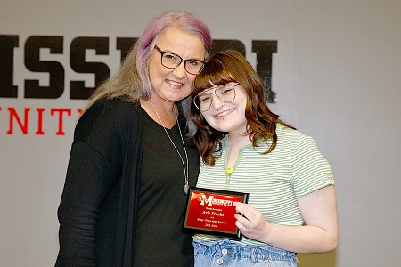 East Mississippi Community College student Arin Franks, at right earned second place in the 2023-24 Mississippi Community College Creative Writing Association’s (MCCWA) annual workshop and contest in the Poetry category. Here, she is recognized by EMCC Creative Writing instructor Marilyn Ford, at left, during the annual Awards Day for students on the college’s Golden Triangle campus.