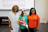 EMCC Adult Education graduate Glynis Lambeth, at center, completed the FlightPath9 MS Aviation Manufacturing program at The Communiversity, which led to a paid internship at Airbus Helicopters. Glynis is pictured here at the FlightPath9 graduation with EMCC Adult Education Assistant Director Mary Ann Latham, at left, and Adult Education Director Tshurah Dismuke. 
