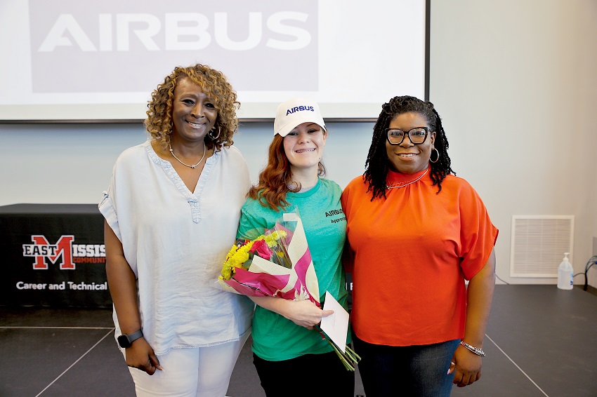 EMCC Adult Education graduate Glynis Lambeth, at center, completed the FlightPath9 MS Aviation Manufacturing program at The Communiversity, which led to a paid internship at Airbus Helicopters. Glynis is pictured here at the FlightPath9 graduation with EMCC Adult Education Assistant Director Mary Ann Latham, at left, and Adult Education Director Tshurah Dismuke. 