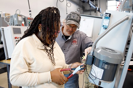 East Mississippi Community College Electrical Technology instructor Terry Warren, at right, works with a student in one of the labs at The Communiversity. During the 2024 academic year, EMCC awarded a total of 921 certificates and degrees. 