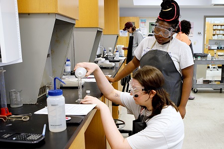 Students participate here in an experiment during a chemistry lab at East Mississippi Community College. About 80 percent of former EMCC students with an Associate of Applied Science degree were employed in Mississippi within one year of graduation, according to a study commissioned by the Mississippi Association of Community Colleges.