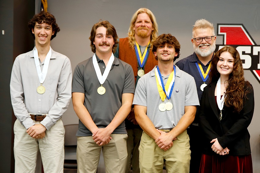 Phi Theta Kappa Honor Society advisors for EMCC’s Beta Iota Zeta chapter on the college’s Golden Triangle campus Dr. Brian Tesch, back row at left, and Scott Baine, back row at are pictured during a Oct. 28 member induction ceremony with the chapter’s new student officers, who are Linden Stelioes-Wills, president, Brayden Shields, vice president of leadership; James 