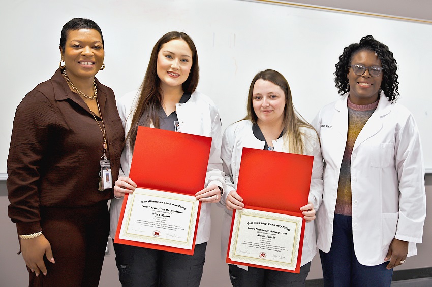 East Mississippi Community College Associate Degree Nursing students Macy Minor, second from left, and Alyssa Franks, third from left, are presented certificates for providing medical assistance at the scene of an automobile accident, by EMCC Director of Nursing Programs/Associate Dean of Health Sciences Jamonicia Johnson, at right, and Associate Degree Nursing Division Chair Dr. Eljenette West, at left.